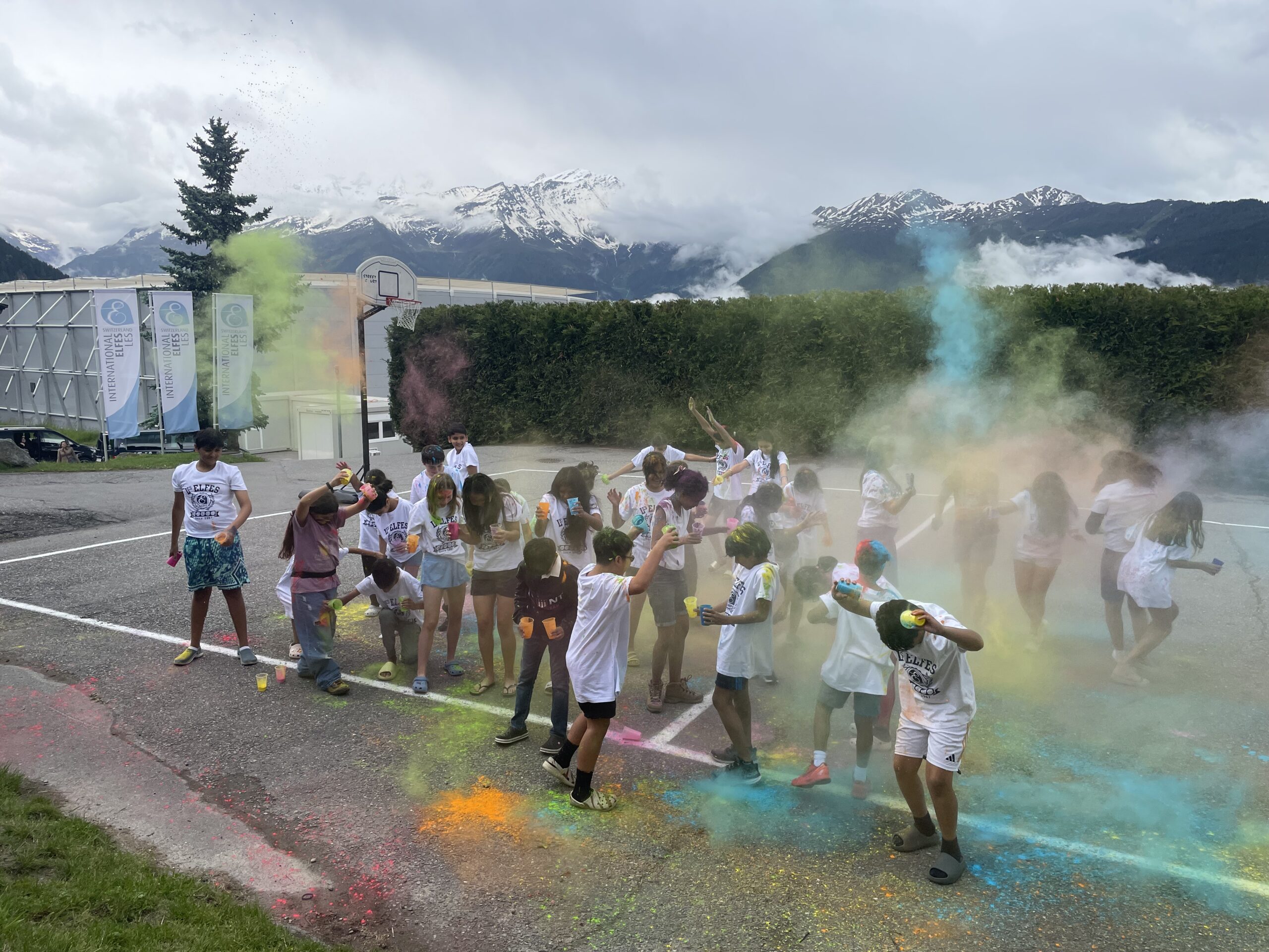 Kids having fun outside playing with paint