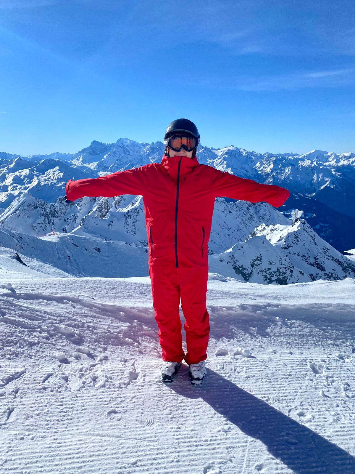 Child with red winter ski outfit on