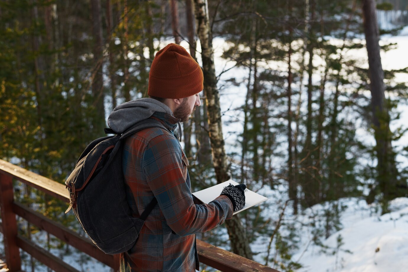 Person winter backpacking with navigation