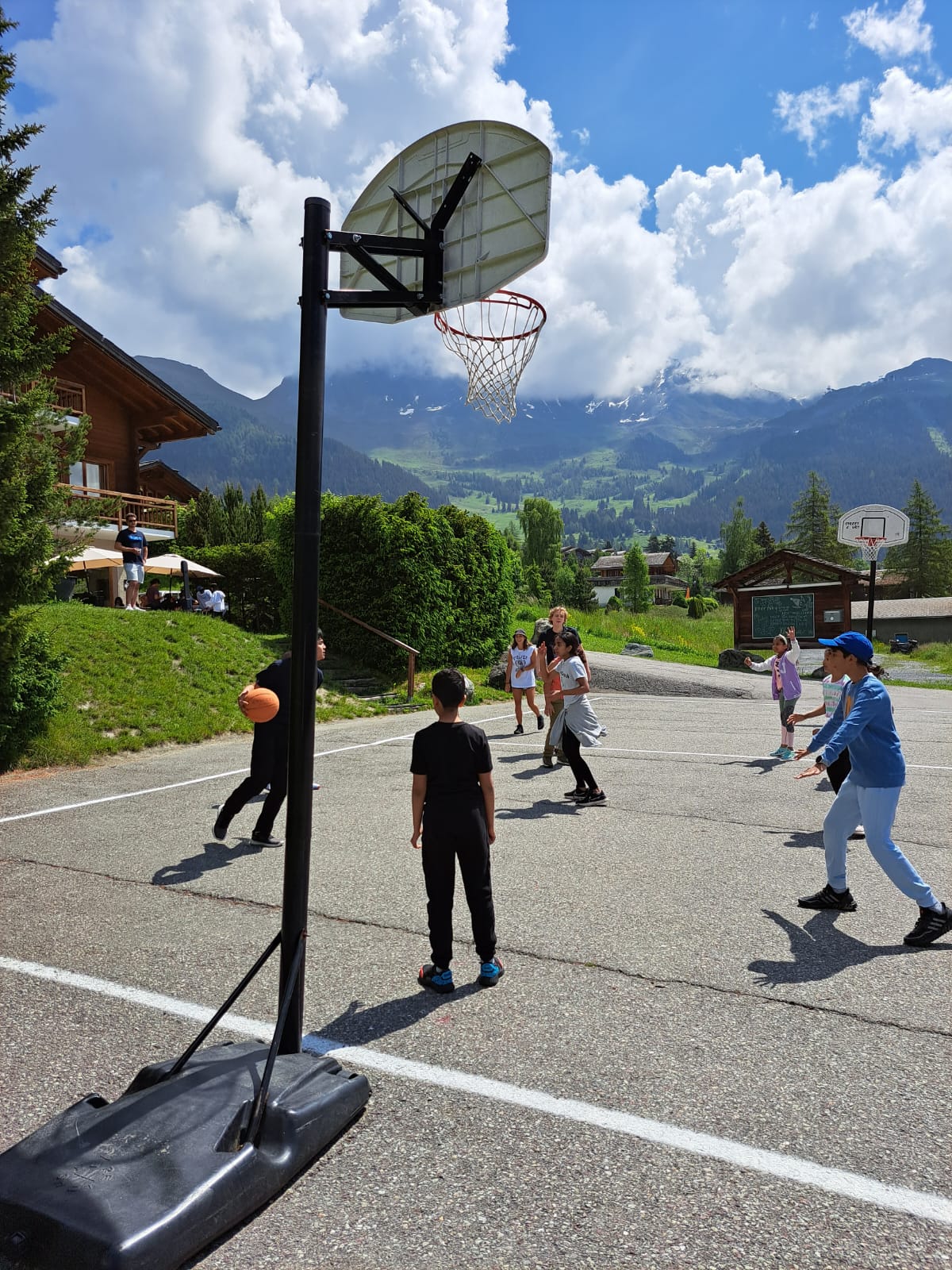 Kids playing an exciting basketball game