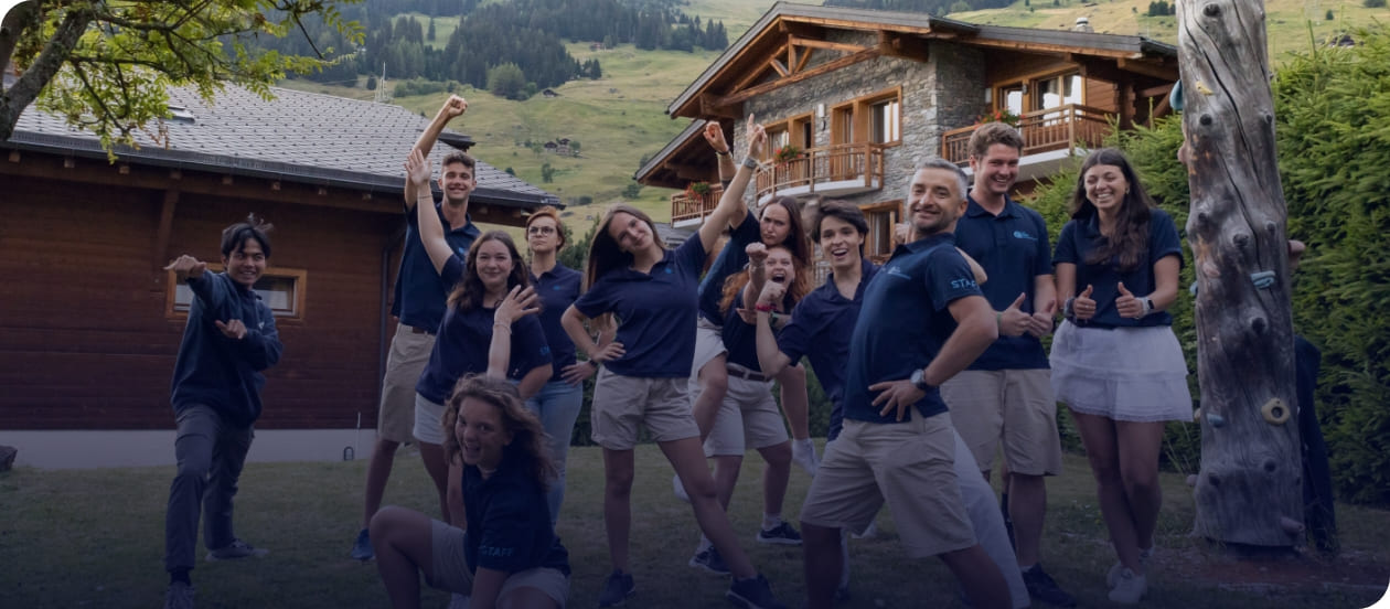 Picture of Les Elfes international staff looking Professional and fun and posing in front of the summer camp campus in 2024