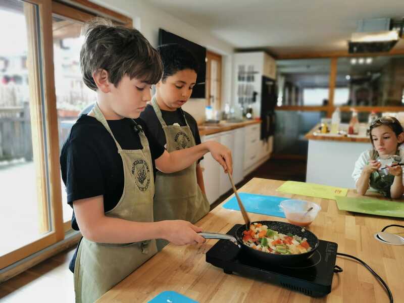 Childre learning how to cook during their workshop at Les Elfes International Summer camp 2024