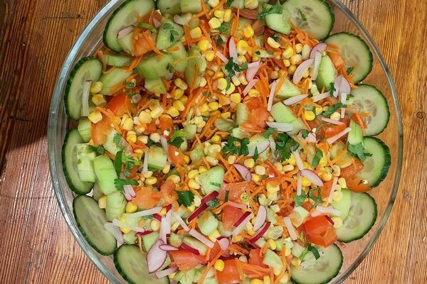 Mixed salad of corn, cucumber, carrots and tomatoes served at the 2024 summer camp of Les Elfes international in Verbier Switzerland