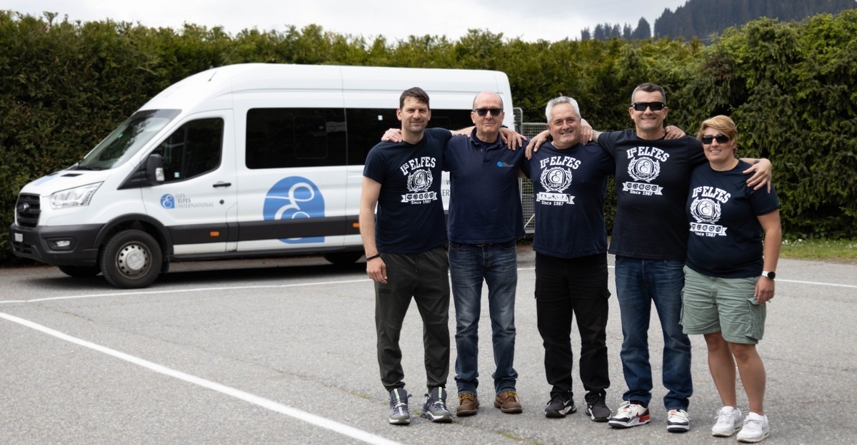 Les Elfes International camp has a team of drivers that take campers to all of their activities during summer camp. In this picture they are seen posing in their uniform in front of the Les Elfes branded private bus