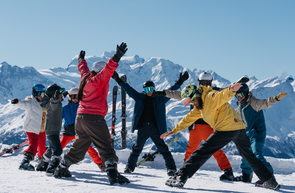 Group of campers from Les Elfes Winter Camp warming up before hitting the slopes